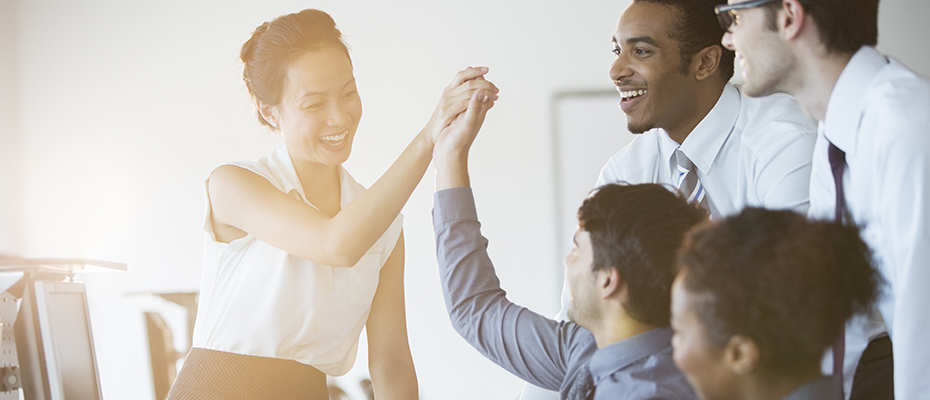 Colleagues celebrating business success